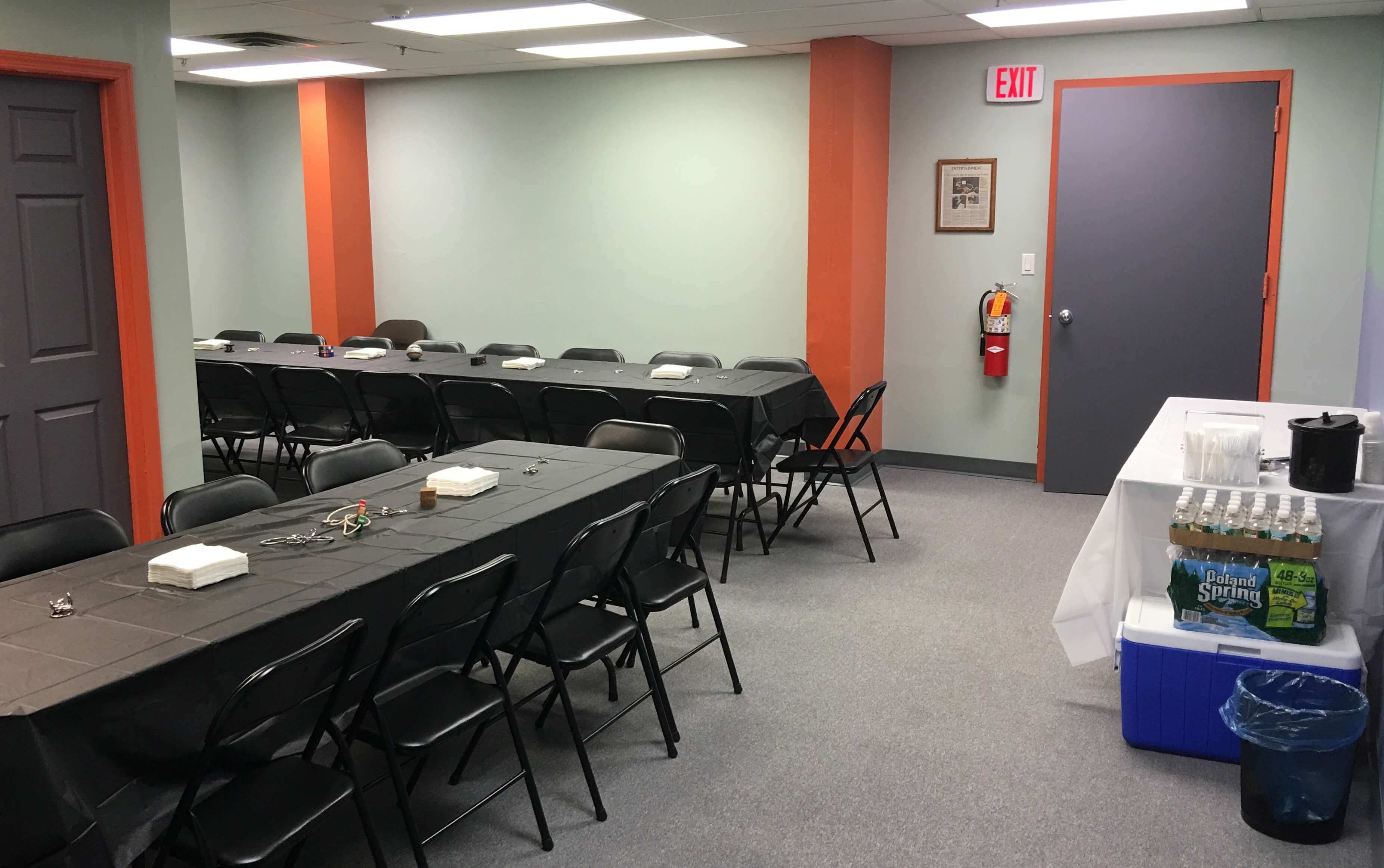 Private party room set up with tables and chairs